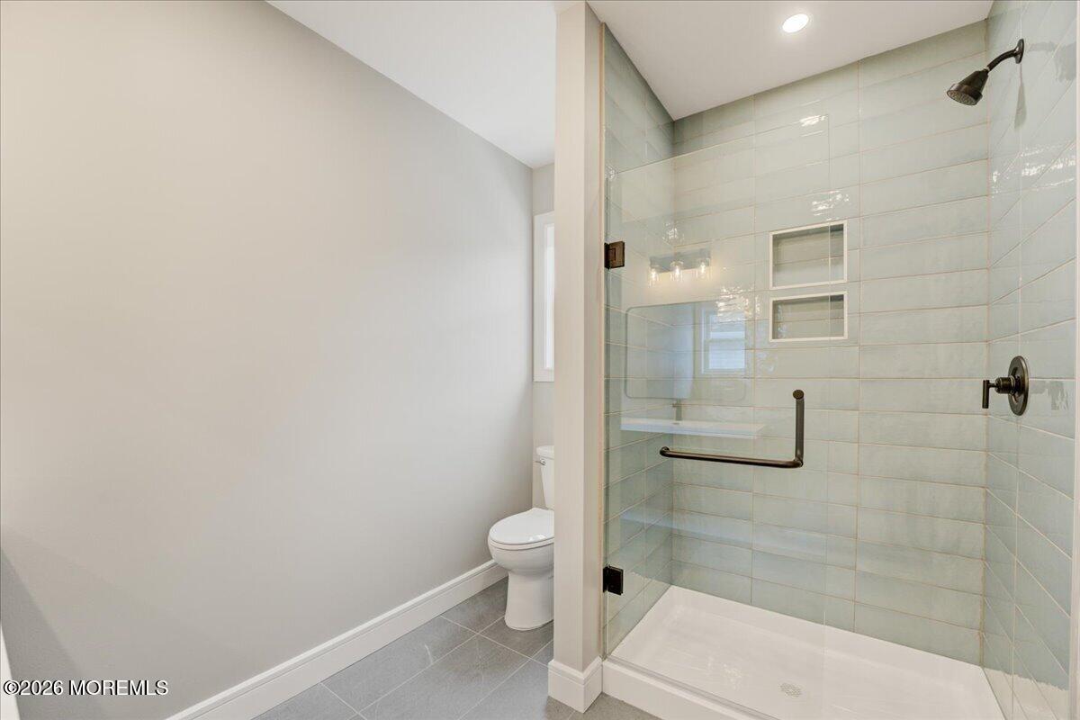 16 West Raritan Drive Little Egg Harbor, NJ 08087 - Photo 36 of 53 a bathroom with a toilet and a shower