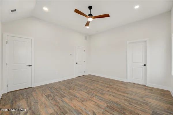 a spacious bathroom with a bathtub and a sink