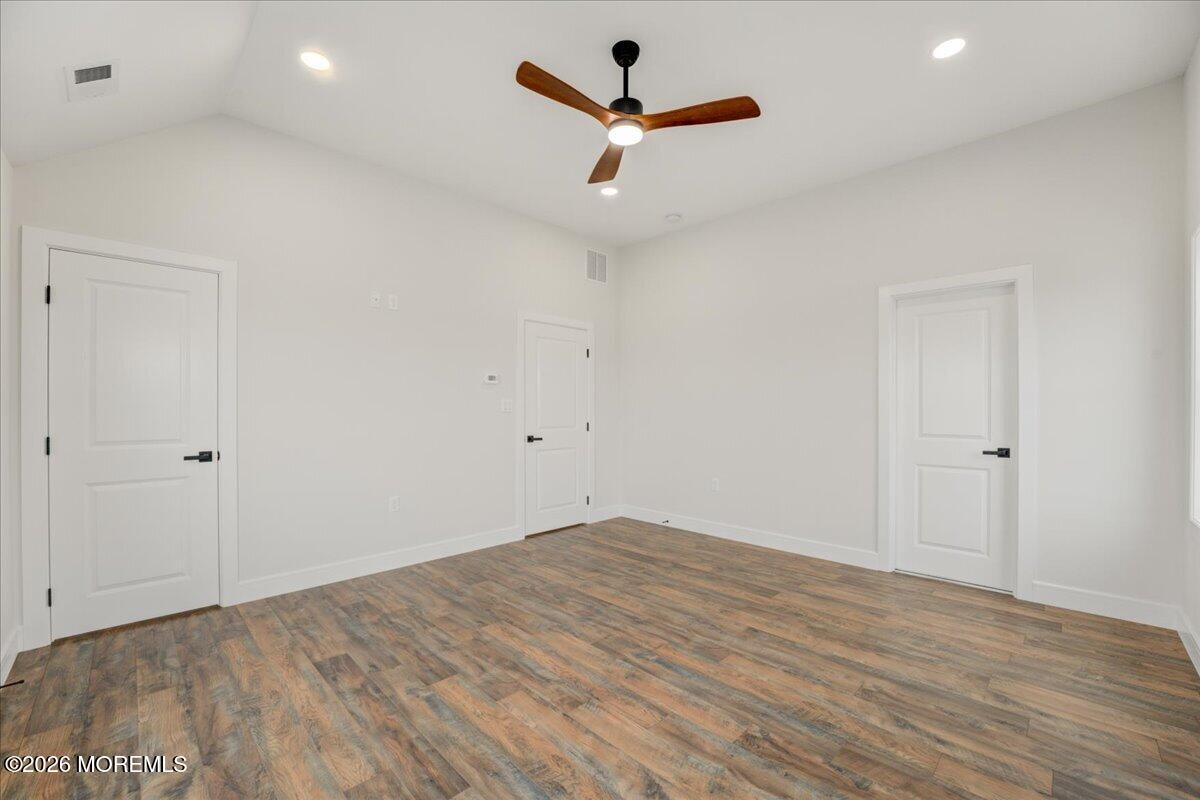 16 West Raritan Drive Little Egg Harbor, NJ 08087 - Photo 39 of 53 wooden floor in an empty room with a window