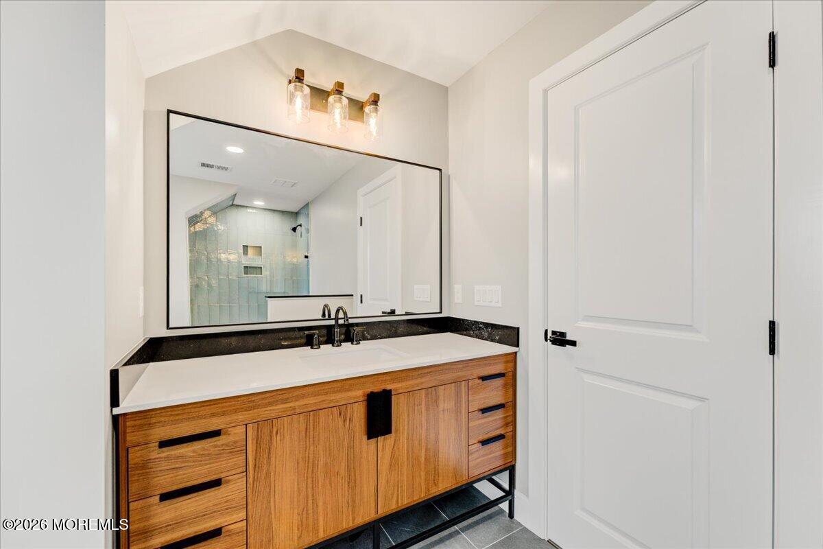 16 West Raritan Drive Little Egg Harbor, NJ 08087 - Photo 43 of 53 a bathroom with a sink and a mirror