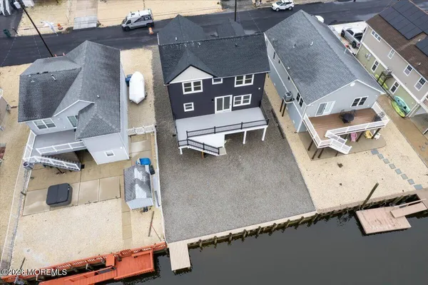 an aerial view of a house with a floor to ceiling window