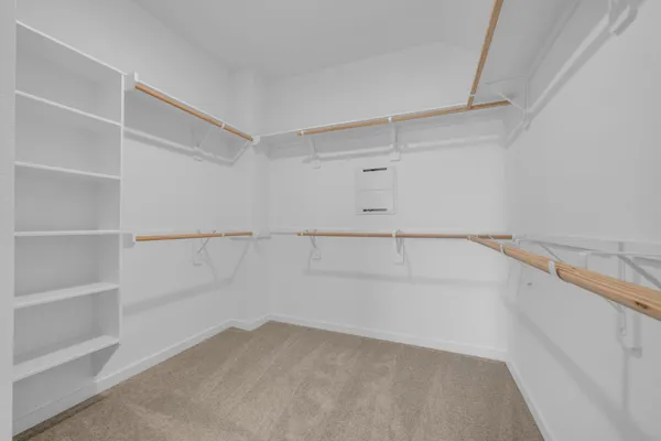 a view of an empty walk in closet