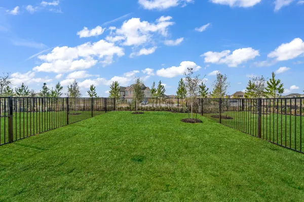 a view of a golf course with a lake view