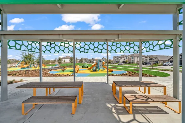 a view of a room with wooden floor and outdoor seating