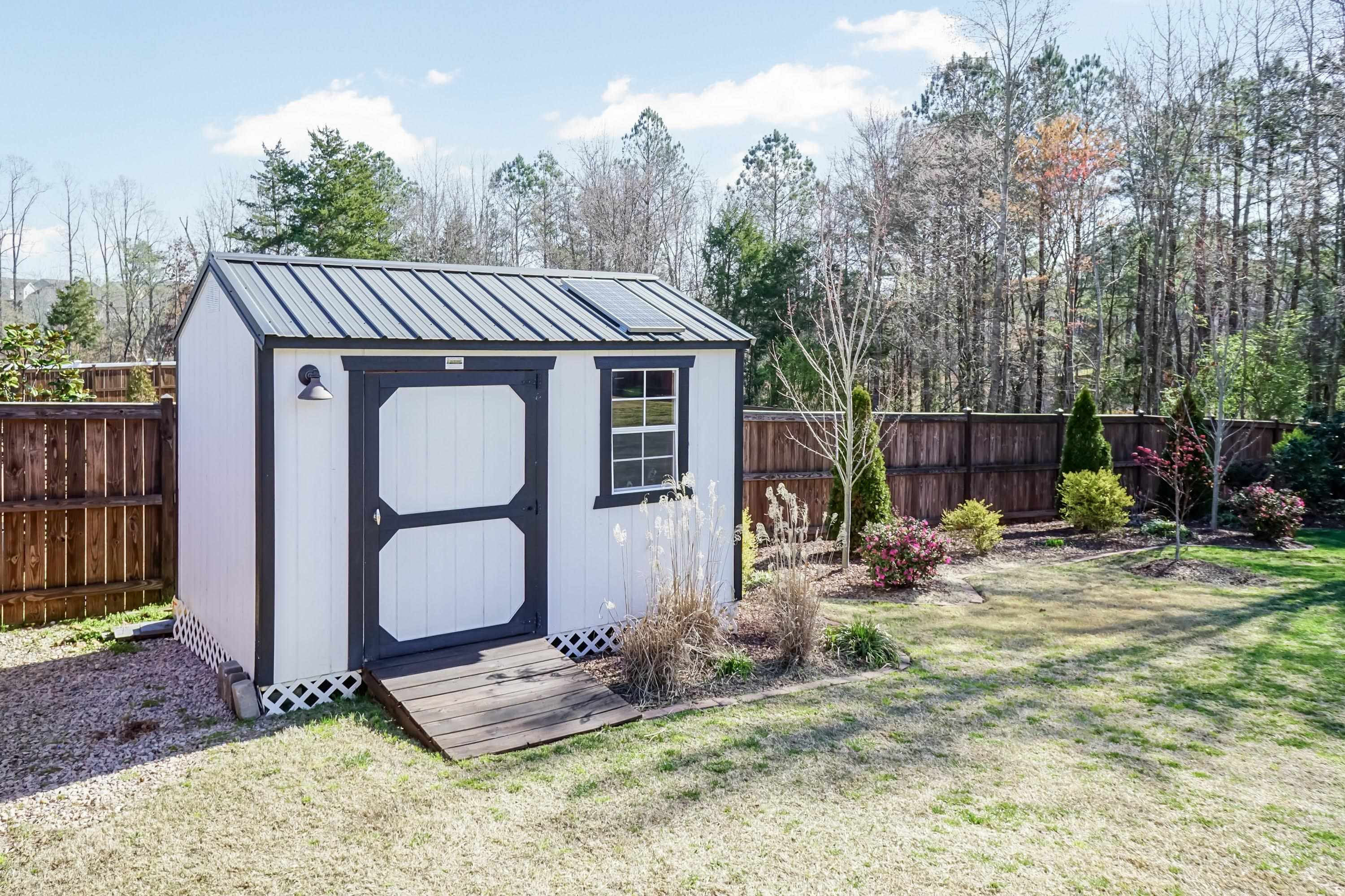 492 Adkins Ridge Road Rolesville, NC 27571 - Photo 11 of 14 a backyard of a house with seating space