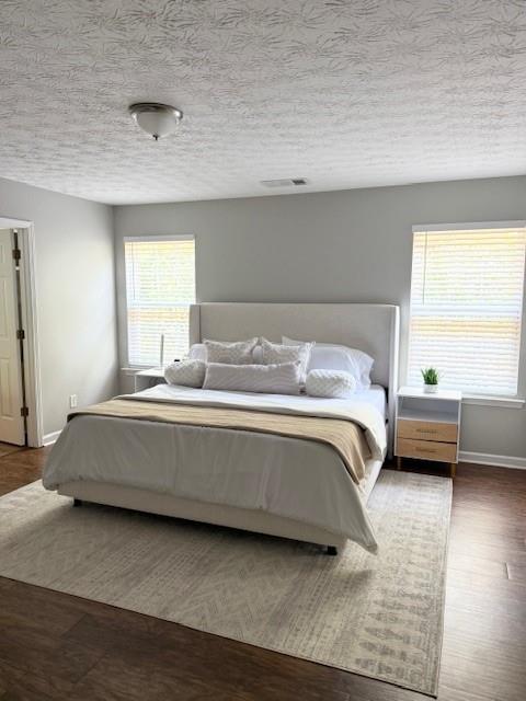 411 Sugar Maple Court Canton, GA 30114 - Photo 17 of 34 a bedroom with a bed and a window