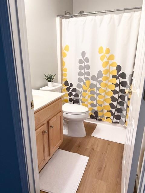 411 Sugar Maple Court Canton, GA 30114 - Photo 28 of 34 a bathroom with a sink a toilet and shower curtain