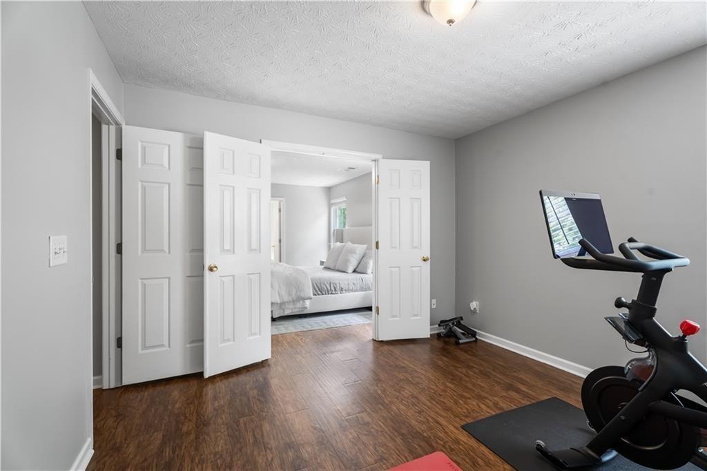 411 Sugar Maple Court Canton, GA 30114 - Photo 31 of 34 a view of a room with gym equipment