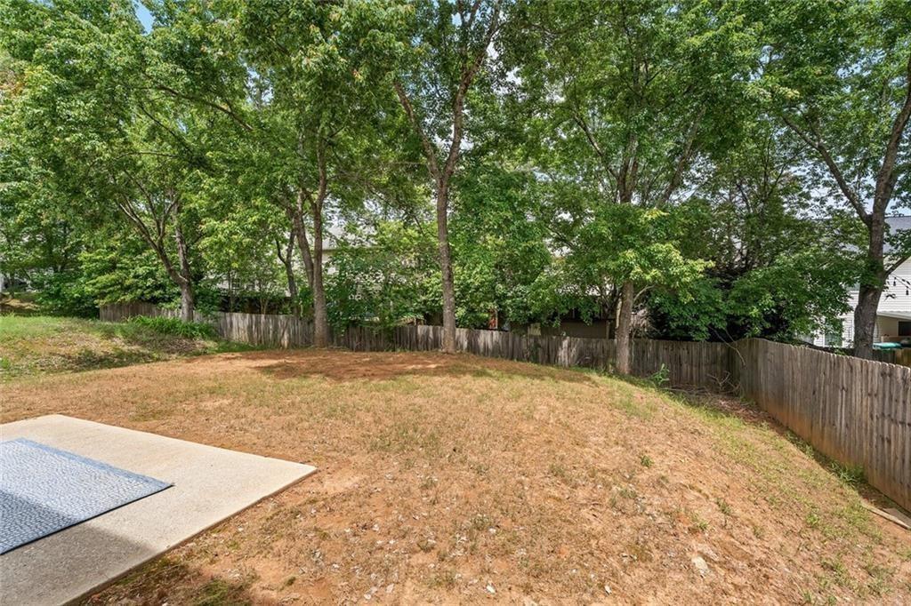 411 Sugar Maple Court Canton, GA 30114 - Photo 34 of 34 a swimming pool with wooden fence