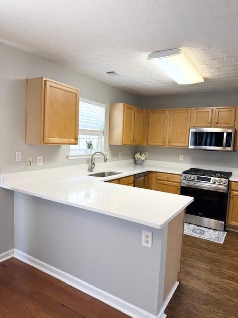 411 Sugar Maple Court Canton, GA 30114 - Photo 8 of 34 a kitchen with stainless steel appliances a sink dishwasher a stove and a microwave oven on wooden floor