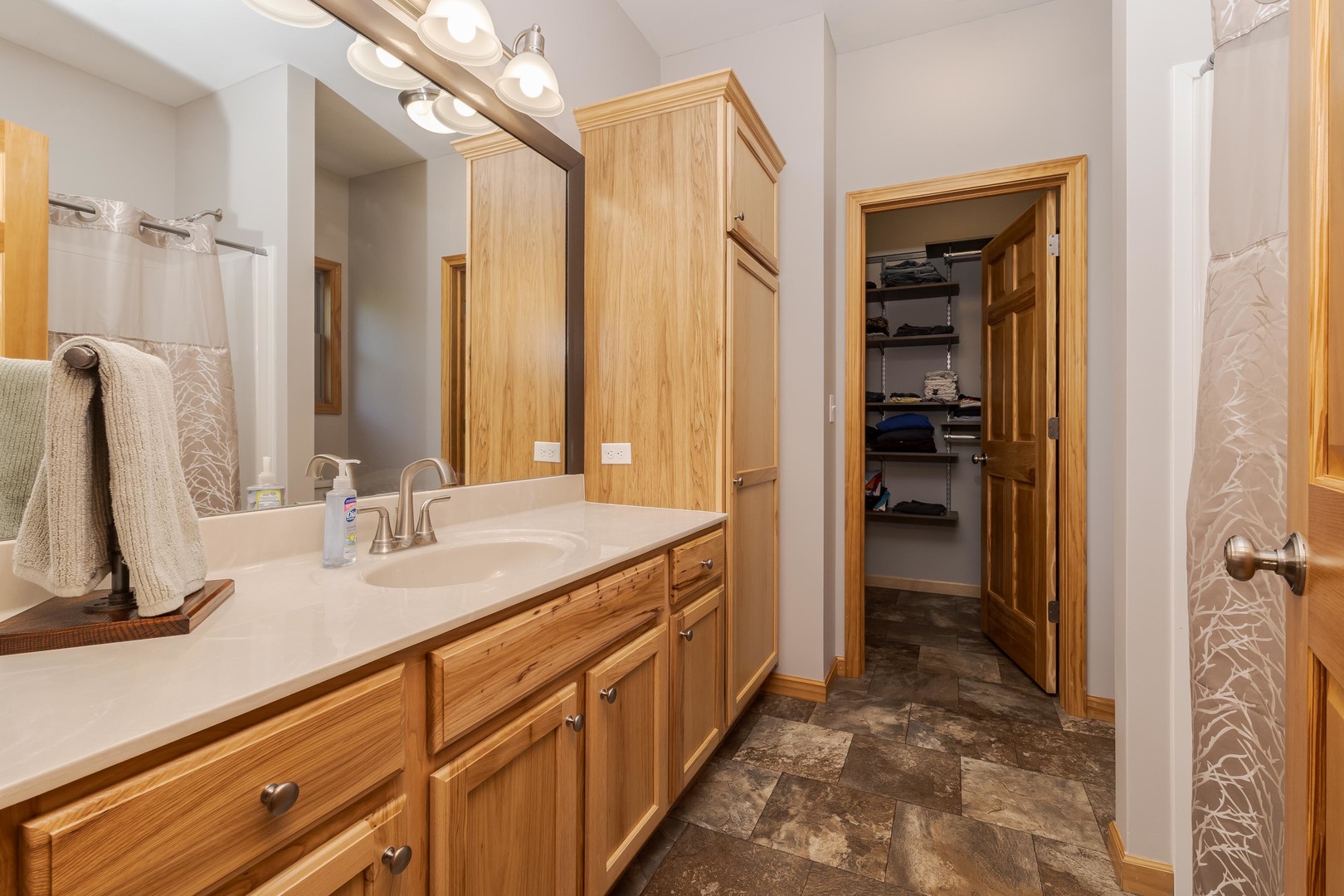 22037 East 2600 N Road Odell, IL 60460 - Photo 28 of 59 a bathroom with a double vanity sink a mirror and a shower