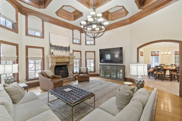 a bedroom with bed and wooden floor