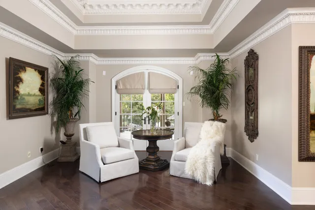 a kitchen with granite countertop white cabinets and stainless steel appliances