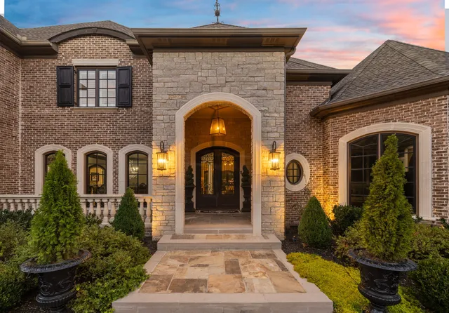 a front view of a house with garden