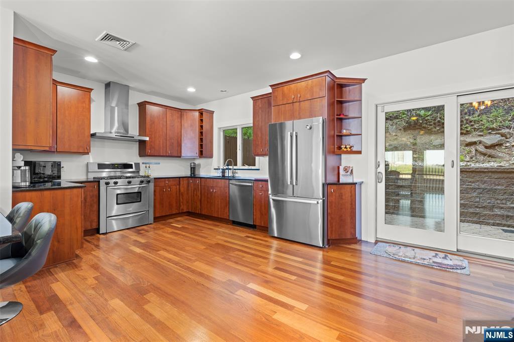 7 Oakdene Terrace, Unit 7 Edgewater, NJ 07020 - Photo 13 of 30 a kitchen with stainless steel appliances granite countertop a refrigerator sink and stove