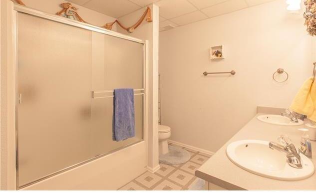 1038 Bowstring Road Monument, CO 80132 - Photo 17 of 25 a bathroom with a sink and shower