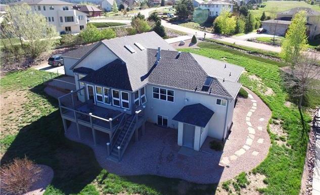 1038 Bowstring Road Monument, CO 80132 - Photo 23 of 25 an aerial view of a house with a yard basket ball court and outdoor seating