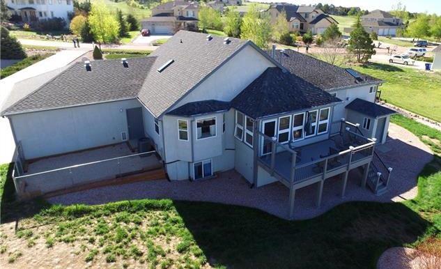 1038 Bowstring Road Monument, CO 80132 - Photo 25 of 25 a view of a house with a yard