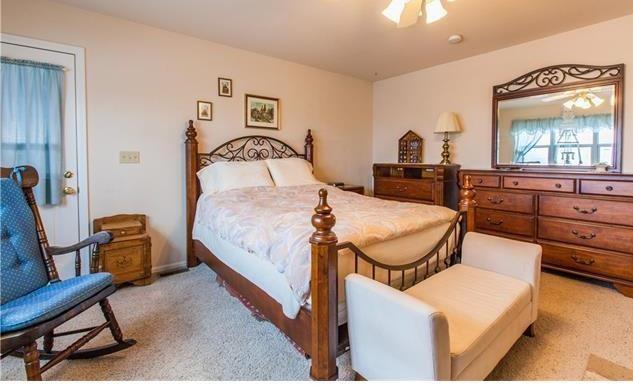 1038 Bowstring Road Monument, CO 80132 - Photo 10 of 25 a bedroom with furniture and a window