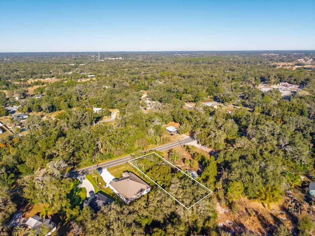 435 County Rd Mount Sorrento, FL 32776 - Photo 17 of 30 an aerial view of residential building and ocean