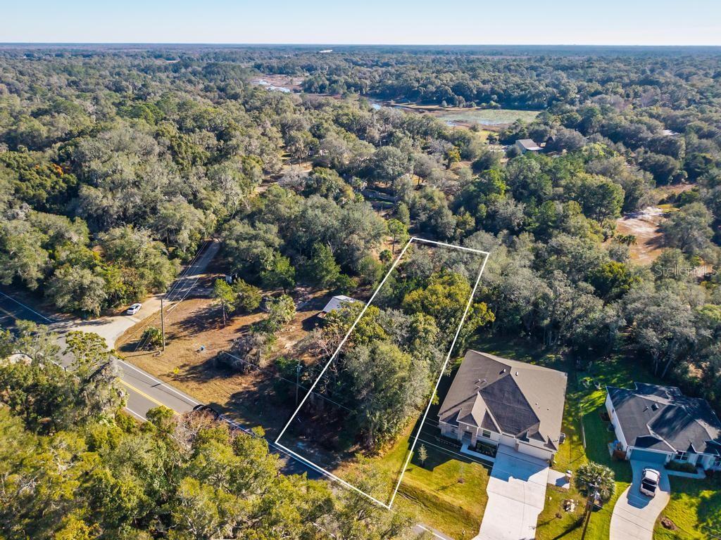 435 County Rd Mount Sorrento, FL 32776 - Photo 18 of 30 an aerial view of a house with a yard