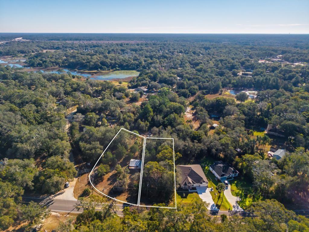 435 County Rd Mount Sorrento, FL 32776 - Photo 26 of 30 an aerial view of residential houses with outdoor space
