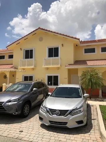 a car parked in front of a house