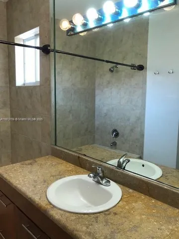 a white toilet sitting next to a shower