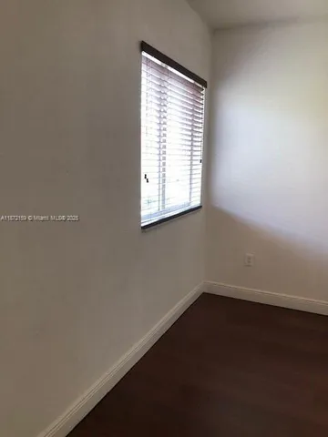a view of storage and utility room with racks on the wall