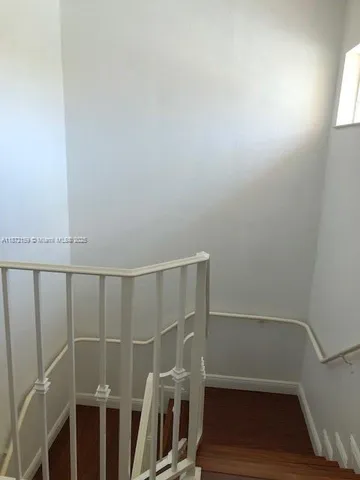 a kitchen with stainless steel appliances granite countertop a refrigerator a stove and a sink with granite countertops