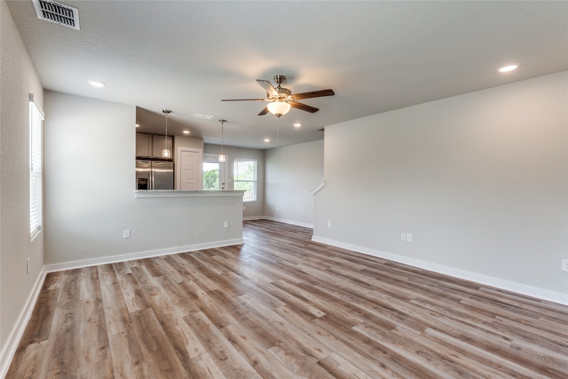 729 Ryan Crossing San Antonio, TX 78253 - Photo 5 of 5 wooden floor in an empty room with a window
