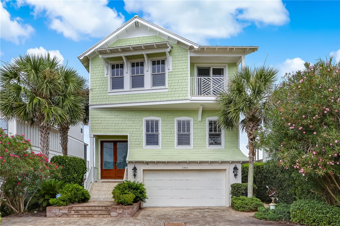 2384 South Fletcher Avenue Fernandina Beach, FL 32034 - Photo 1 of 35 a front view of a house with garden
