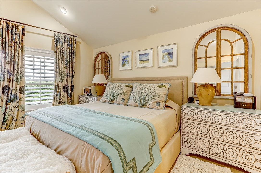 2384 South Fletcher Avenue Fernandina Beach, FL 32034 - Photo 13 of 35 a bedroom with a bed and a large window