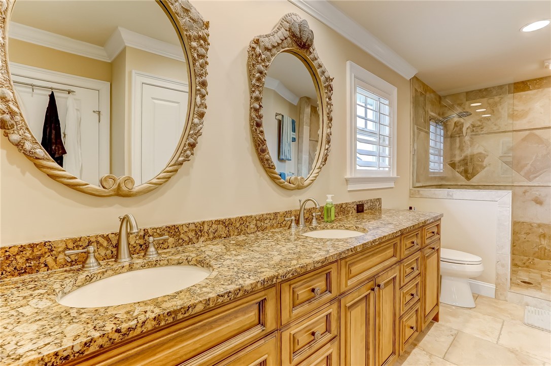 2384 South Fletcher Avenue Fernandina Beach, FL 32034 - Photo 15 of 35 a bathroom with a granite countertop double vanity sink and a mirror