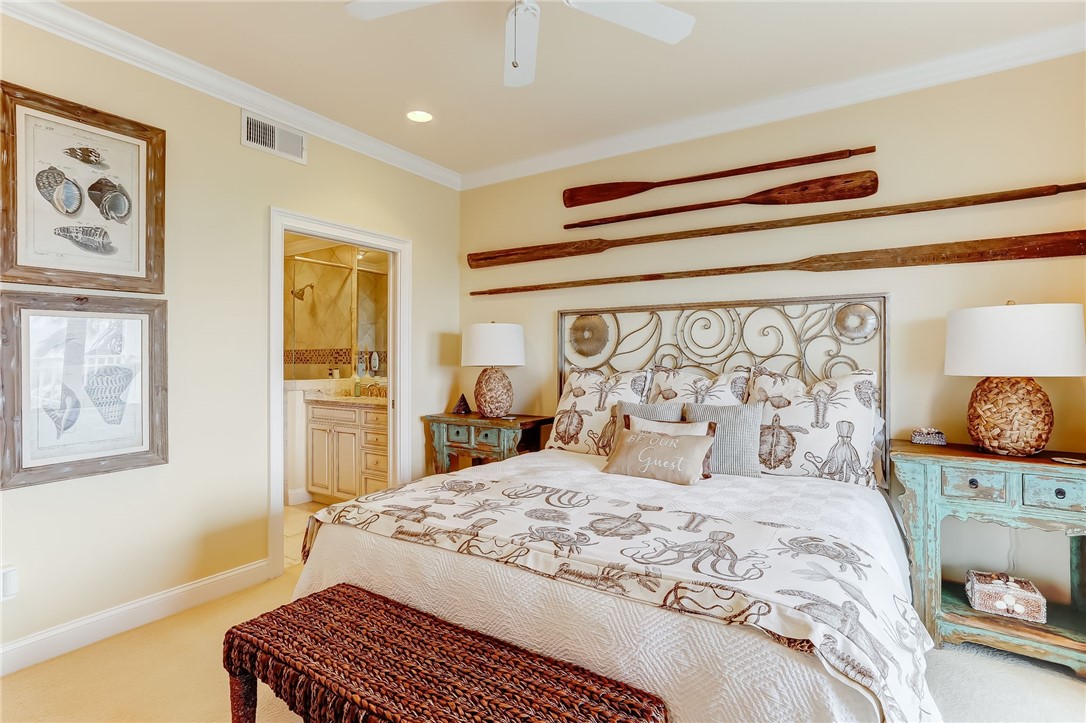 2384 South Fletcher Avenue Fernandina Beach, FL 32034 - Photo 17 of 35 a bedroom with a bed and wooden floor