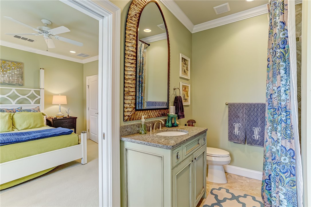 2384 South Fletcher Avenue Fernandina Beach, FL 32034 - Photo 23 of 35 a spacious bathroom with a double vanity sink toilet and a mirror