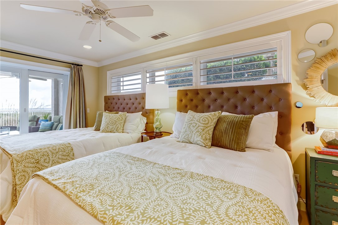 2384 South Fletcher Avenue Fernandina Beach, FL 32034 - Photo 26 of 35 a large bed sitting in a bedroom next to a window