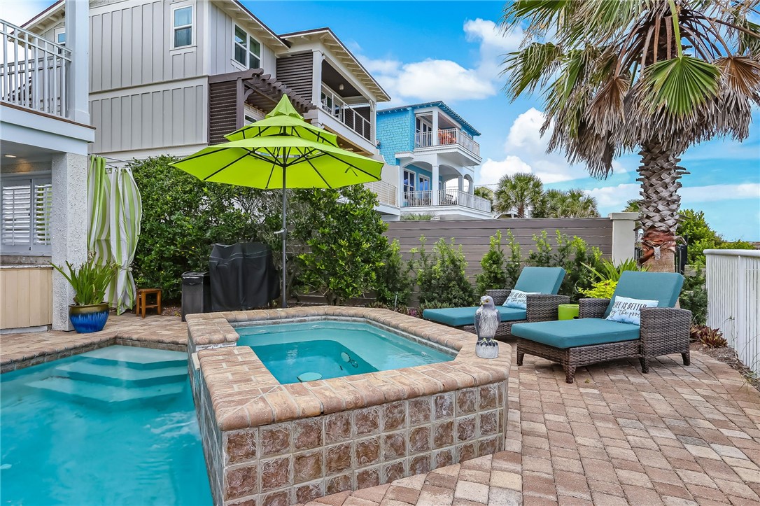 2384 South Fletcher Avenue Fernandina Beach, FL 32034 - Photo 32 of 35 a view of a swimming pool with a chair and tables