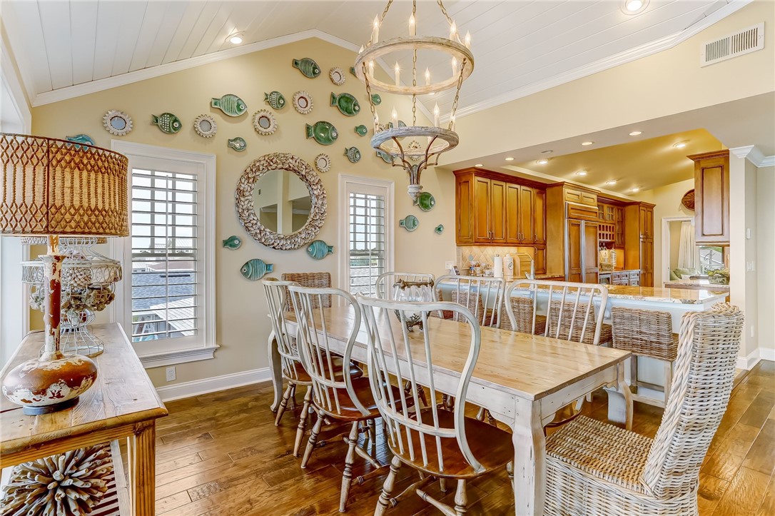 2384 South Fletcher Avenue Fernandina Beach, FL 32034 - Photo 8 of 35 a view of a dining room with furniture and wooden floor