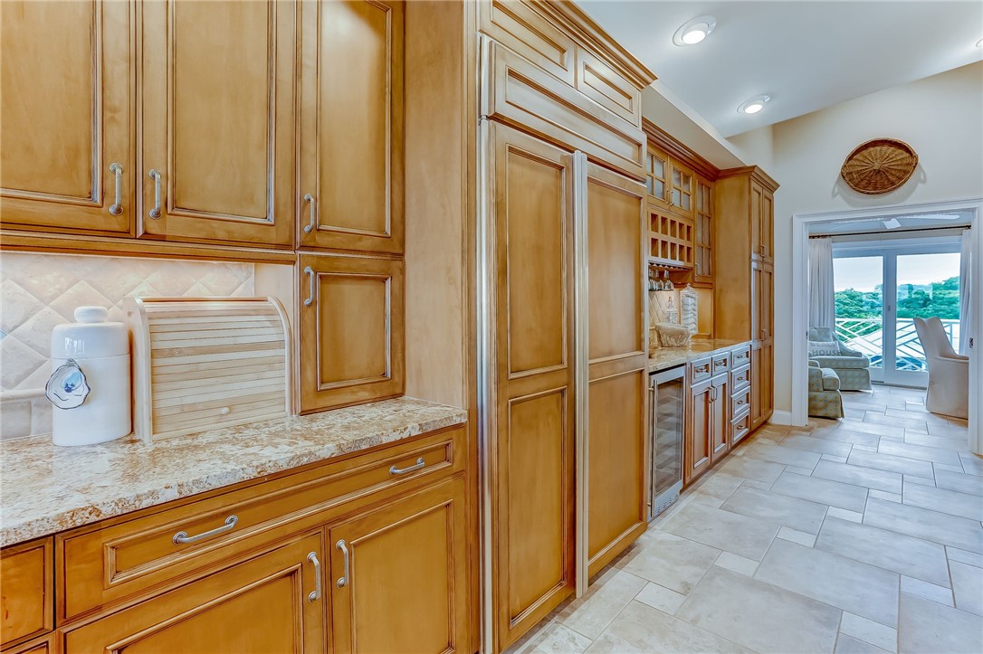 2384 South Fletcher Avenue Fernandina Beach, FL 32034 - Photo 9 of 35 a kitchen with stainless steel appliances granite countertop a refrigerator and a sink