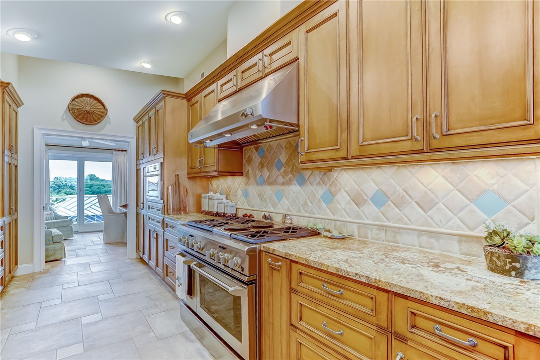 2384 South Fletcher Avenue Fernandina Beach, FL 32034 - Photo 10 of 35 a kitchen with granite countertop cabinets and steel stainless steel appliances