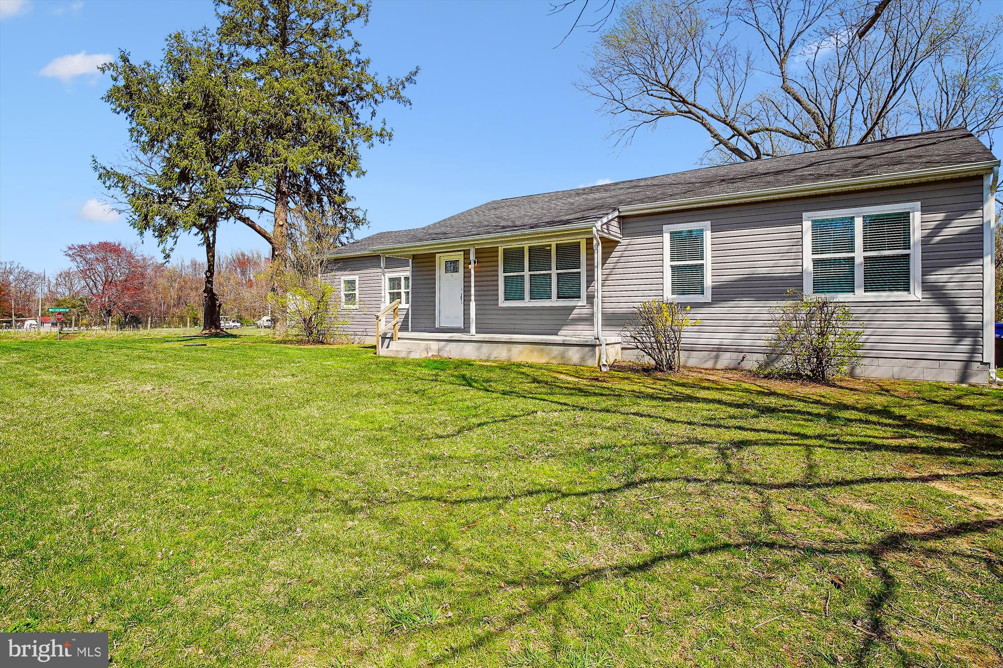 a house view with a sitting space and garden