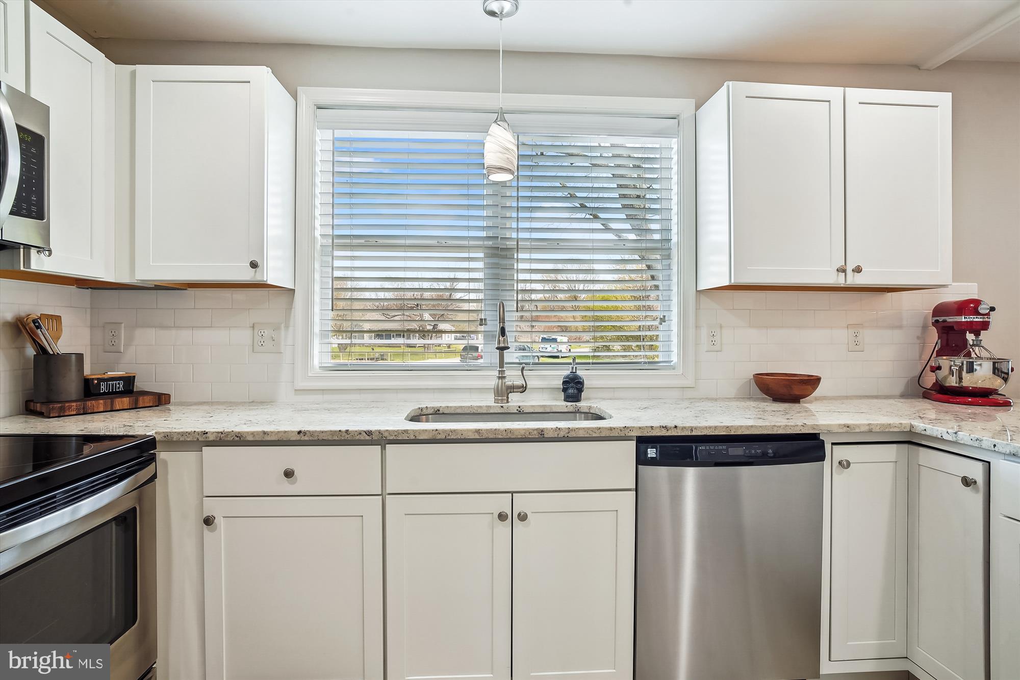 2554 Church Hill Road Centreville, MD 21617 - Photo 12 of 27 a kitchen with granite countertop white cabinets and white appliances