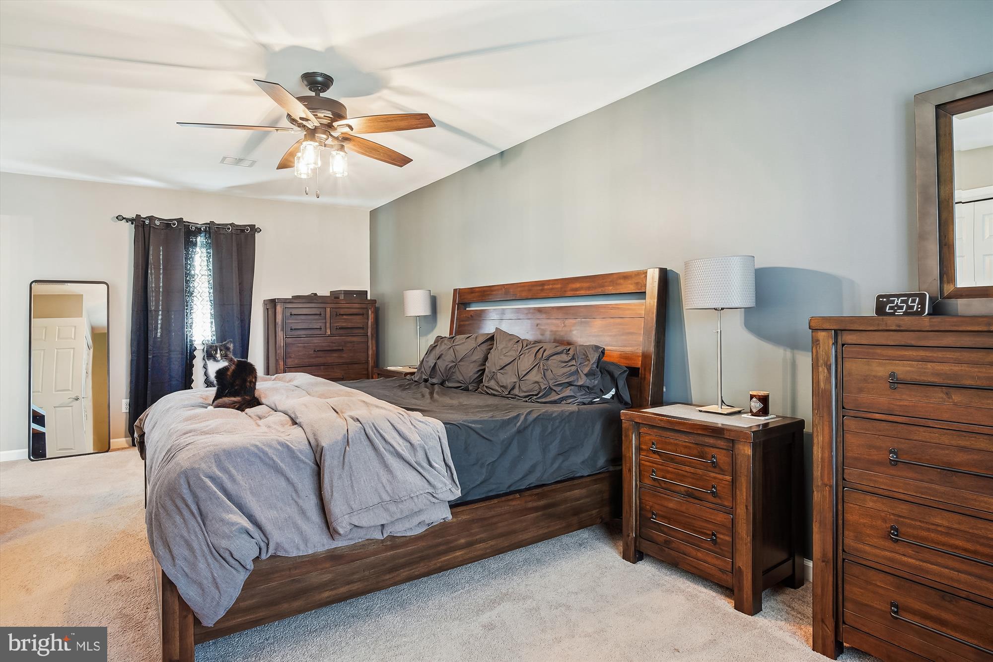 2554 Church Hill Road Centreville, MD 21617 - Photo 14 of 27 a bedroom with a bed and a chandelier