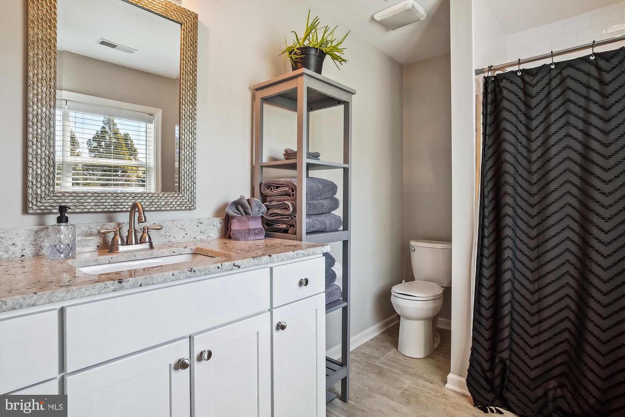 2554 Church Hill Road Centreville, MD 21617 - Photo 16 of 27 a bathroom with a sink and a mirror