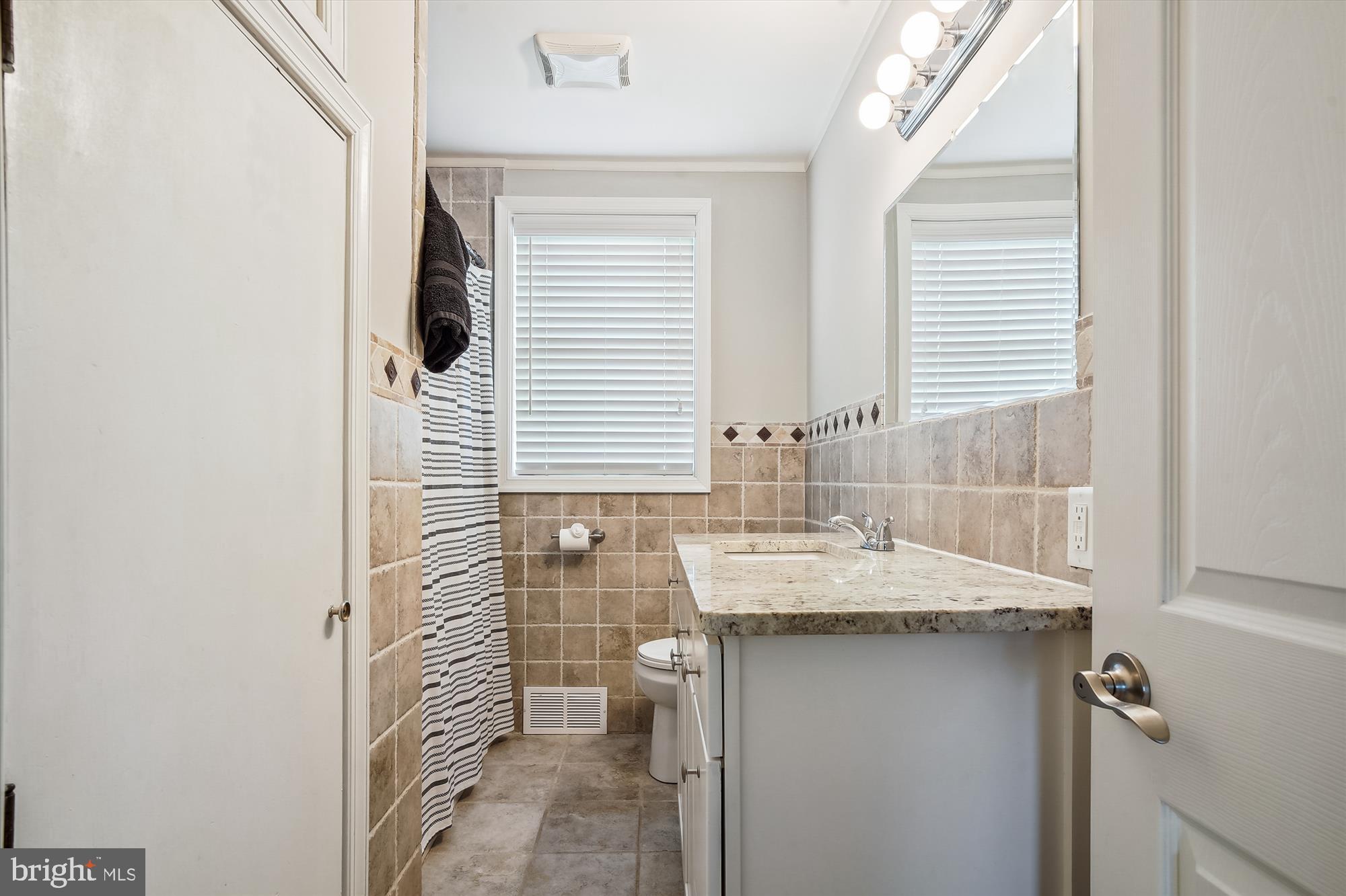 2554 Church Hill Road Centreville, MD 21617 - Photo 23 of 27 a bathroom with a granite countertop sink and a mirror