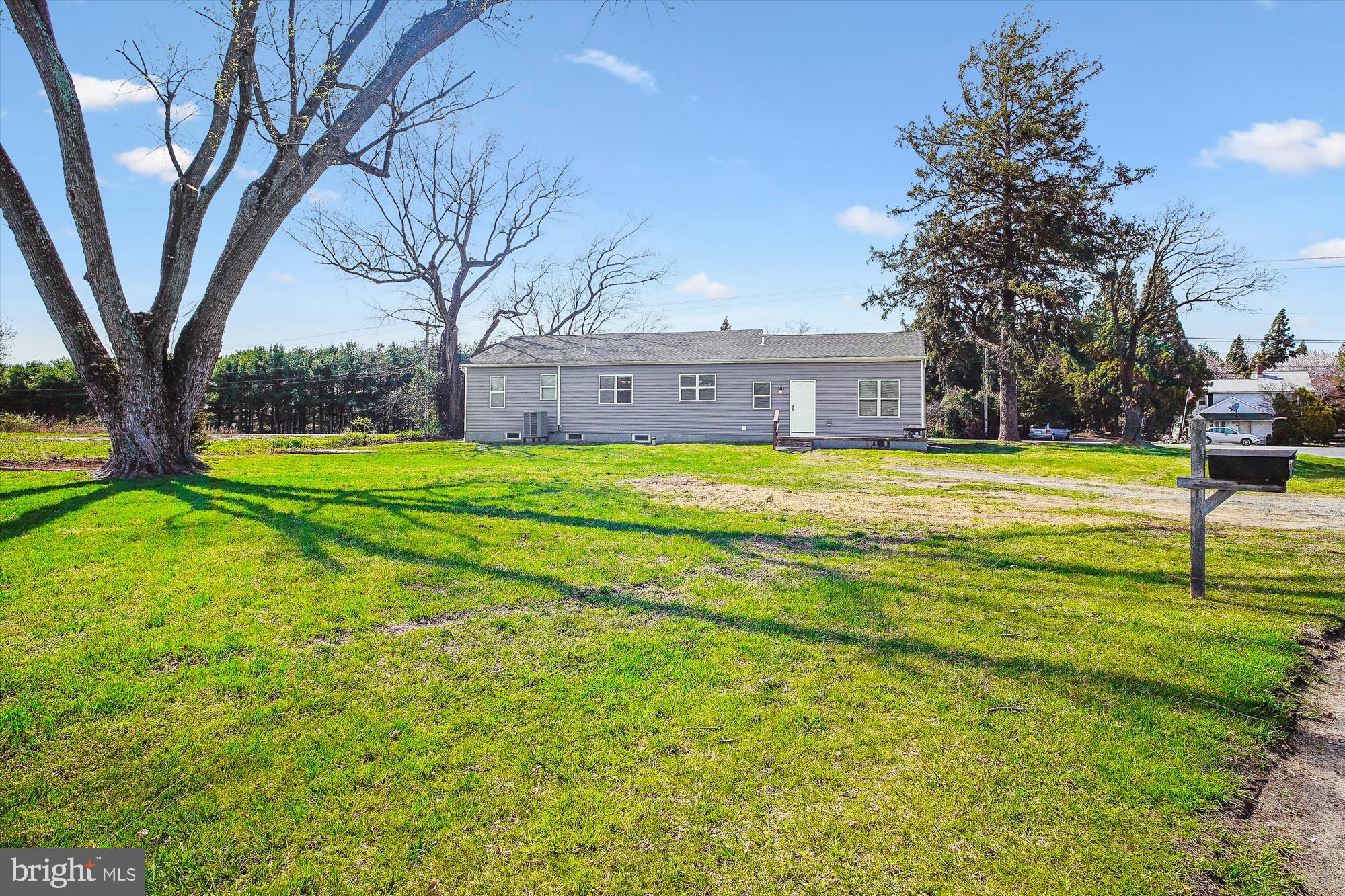 2554 Church Hill Road Centreville, MD 21617 - Photo 26 of 27 a view of a house with a big yard and large trees
