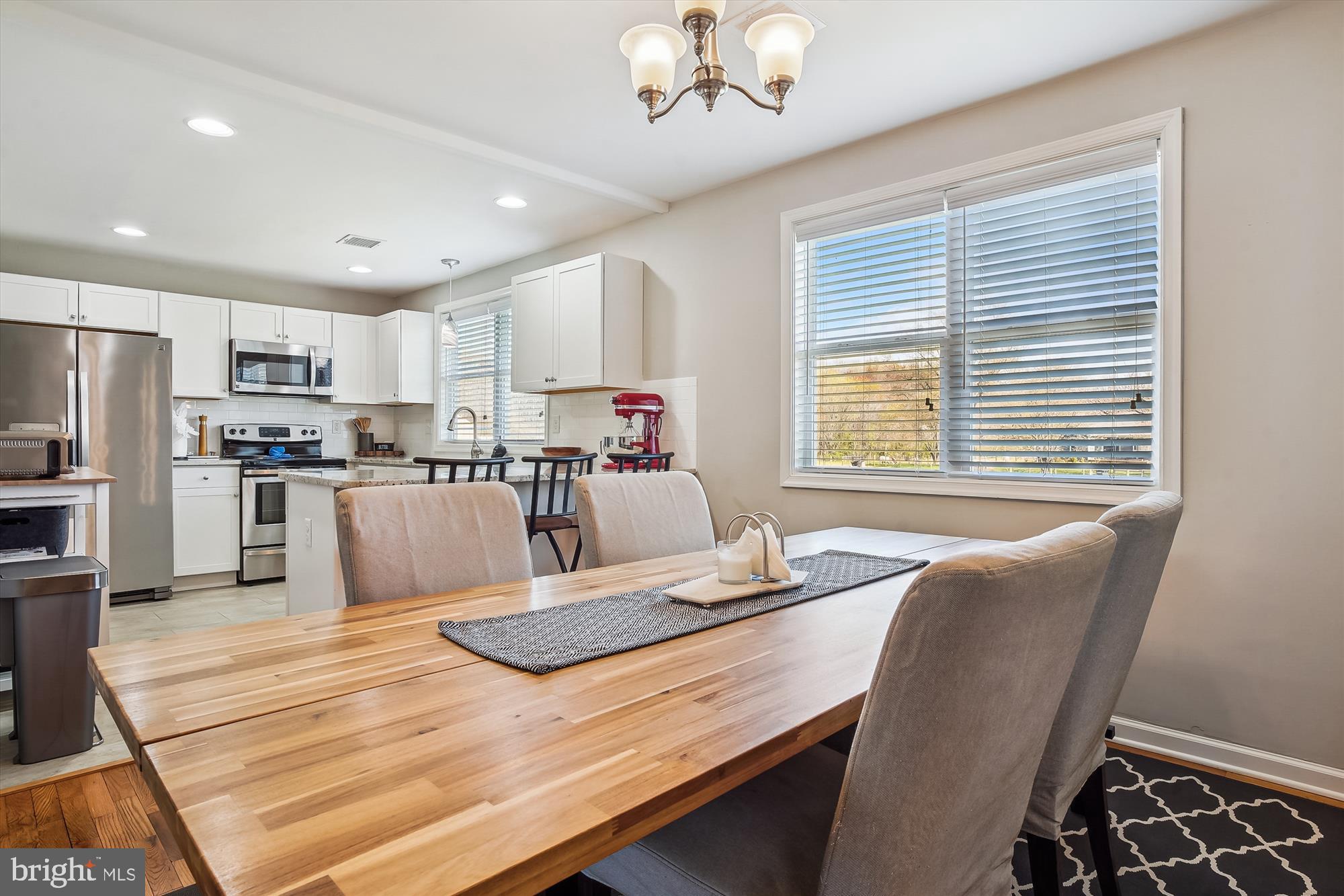 2554 Church Hill Road Centreville, MD 21617 - Photo 6 of 27 a living room with stainless steel appliances kitchen island granite countertop furniture and a kitchen view