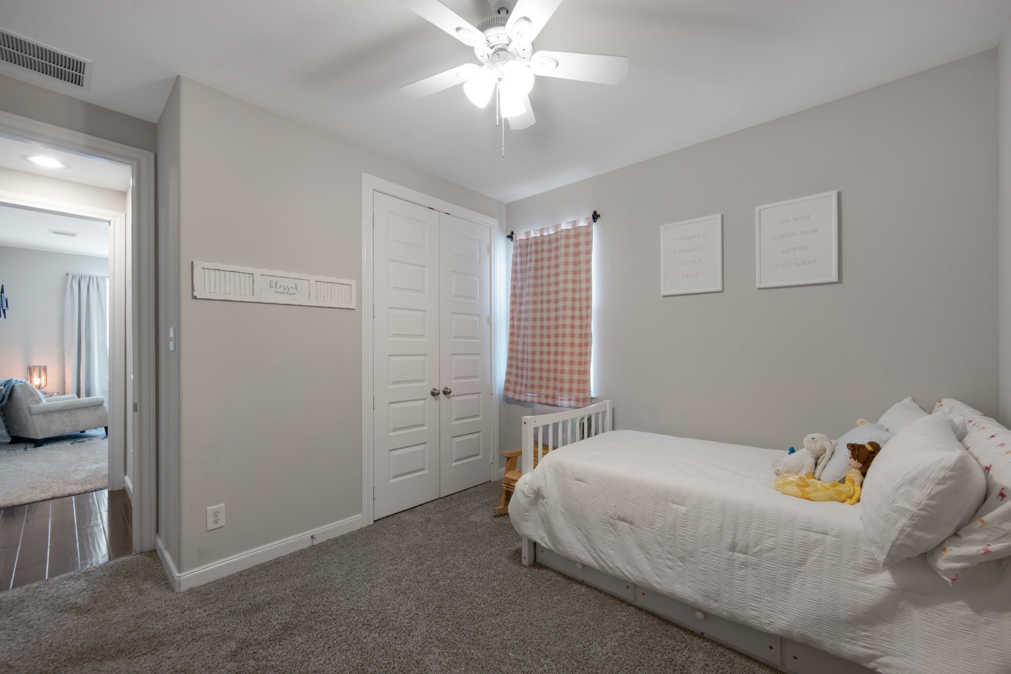 22622 Cutter Mill Drive Spring, TX 77389 - Photo 24 of 40 a bedroom with a bed and a chandelier