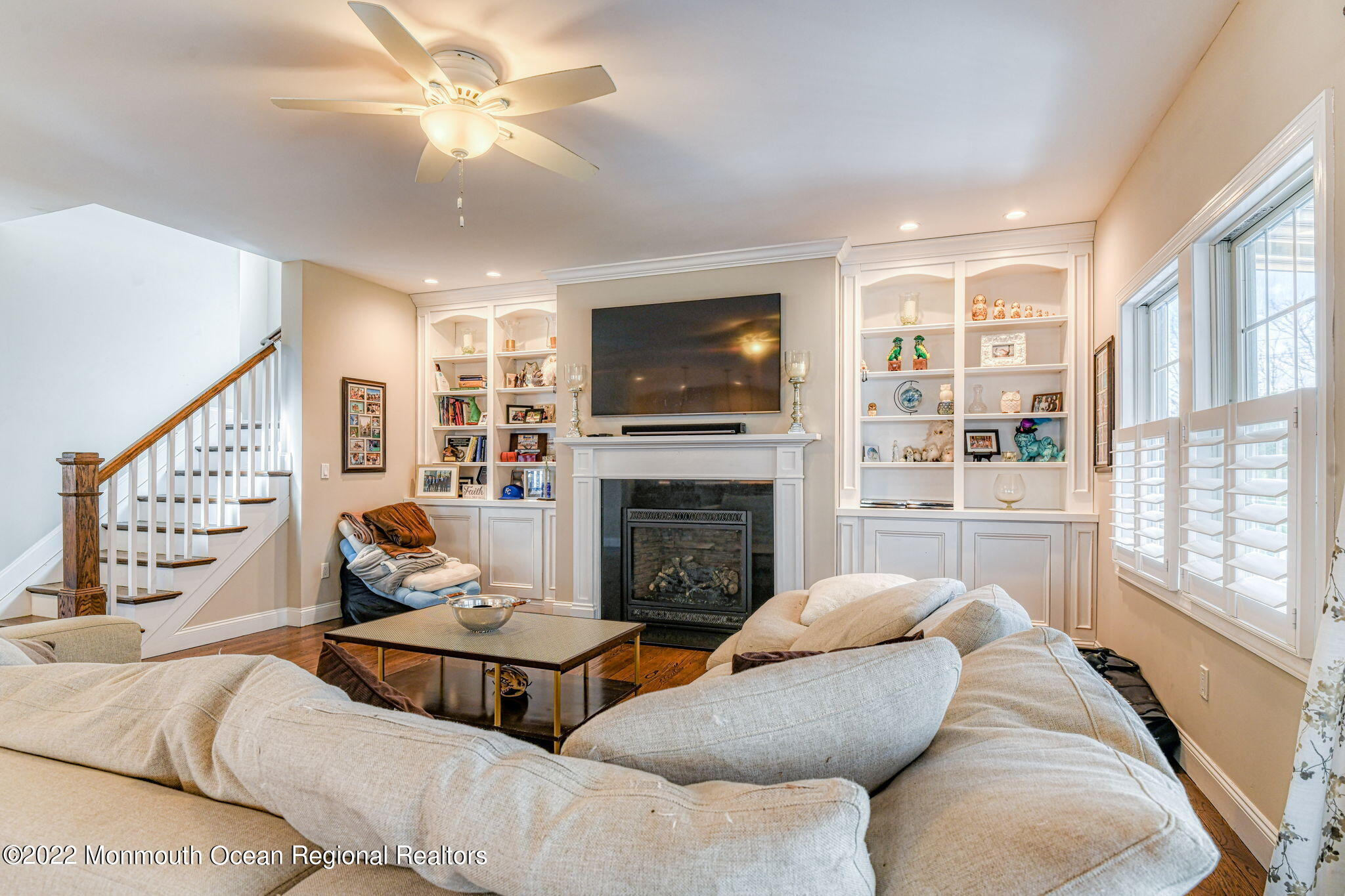 346 South Boulevard Spring Lake, NJ 07762 - Photo 17 of 56 a living room with furniture a flat screen tv and a fireplace